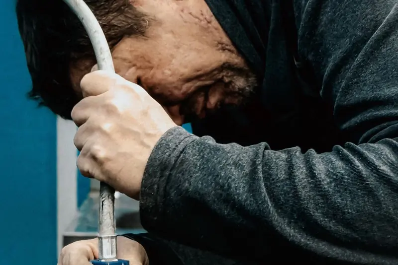 Technician testing a backflow device