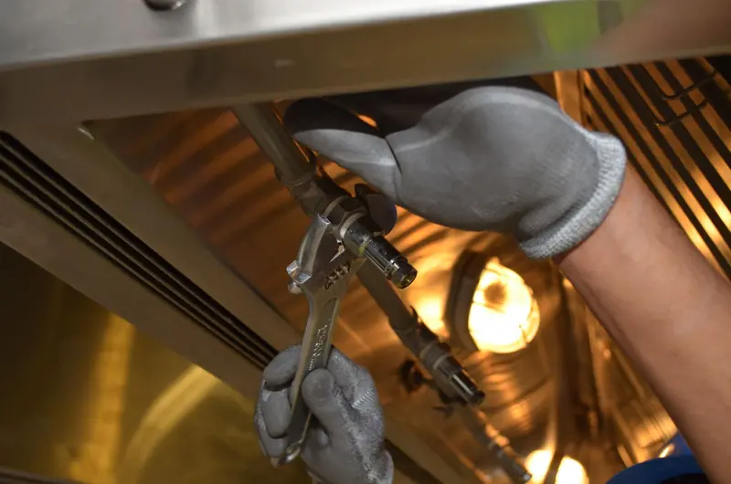 Plumber cleaning a drain line